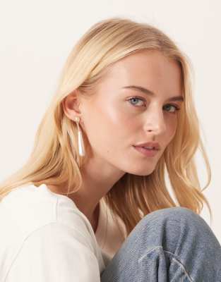 True Decadence long faux pearl drop earrings in gold tone