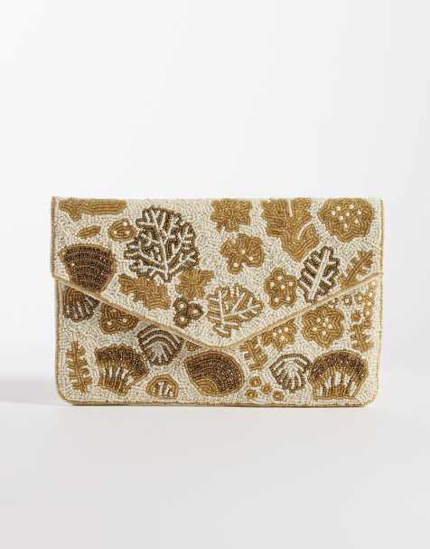 True Decadence - Lys guldfarvet clutch-taske med kuvertform og udsmykket skaldesign - view 1