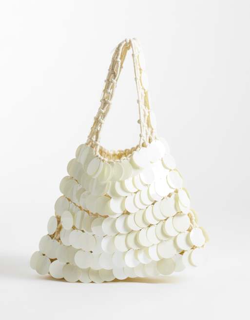 True Decadence mini disc-väska med handtag i cream