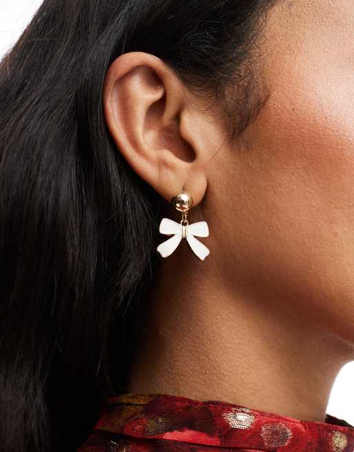 True Decadence - Orecchini pendenti color oro con fiocchi