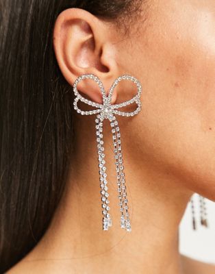 True Decadence oversized bow drop earrings in silver crystal