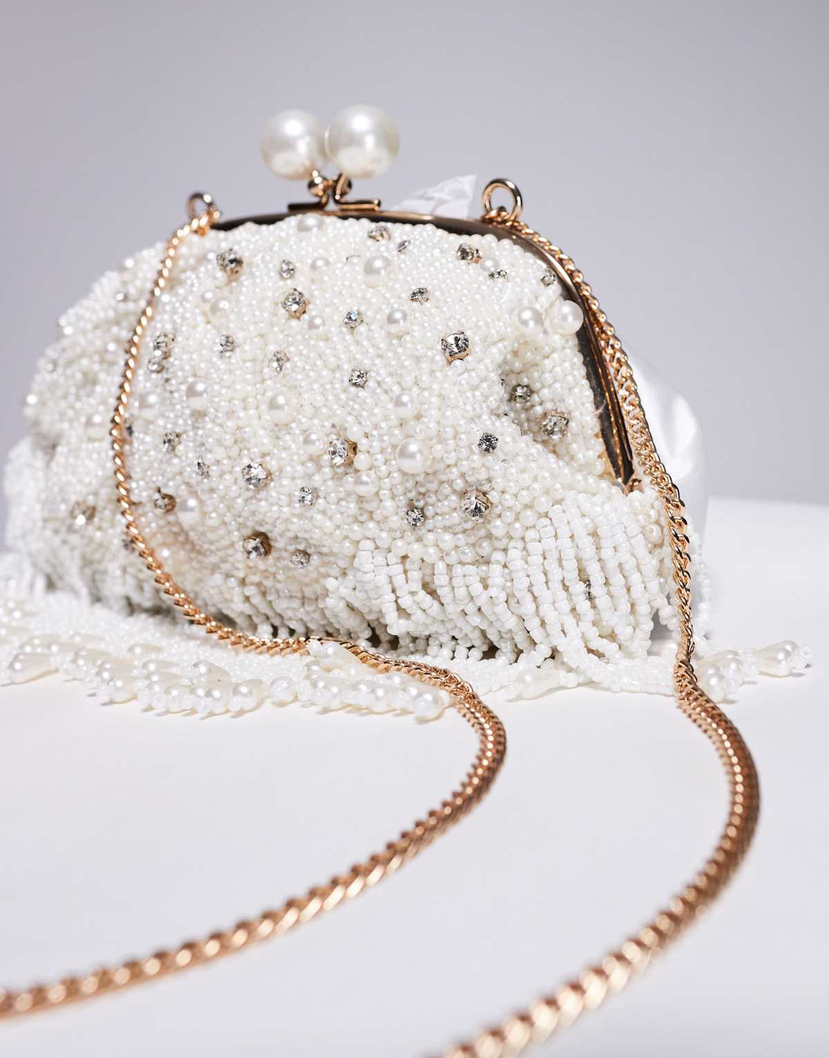 True Decadence pearl and bead soft clutch bag in white