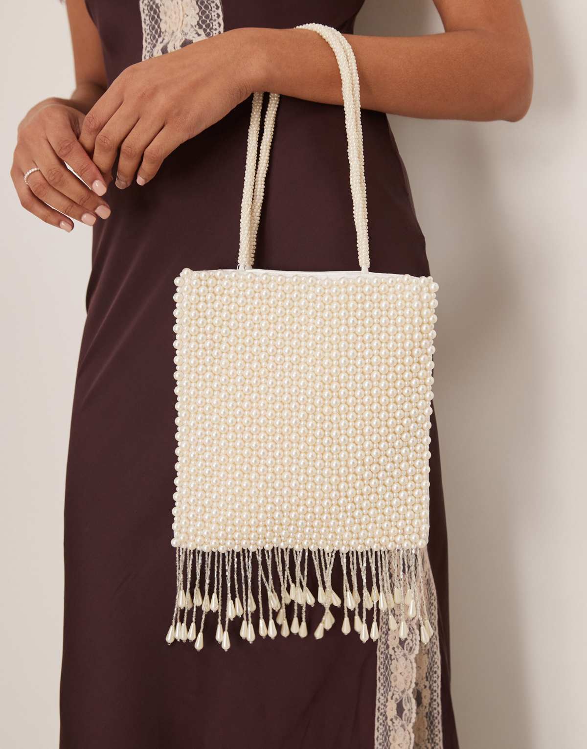 True Decadence pearl beaded bag with tassle in white