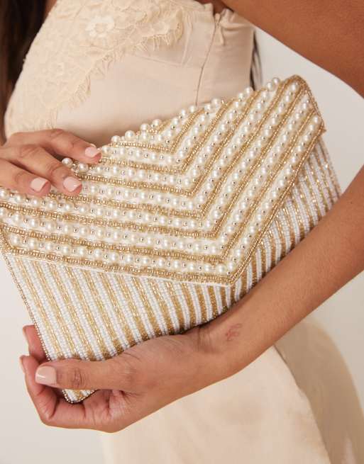 True Decadence Pochette a busta oro a righe con perline e perle