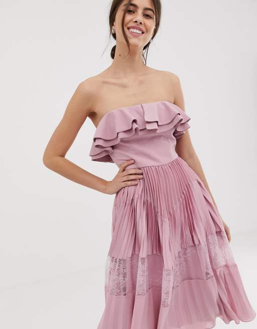 True Decadence Premium Sleeveless Dress With Ruffle Trim And Lace Insert Pleated Skirt In Pink 