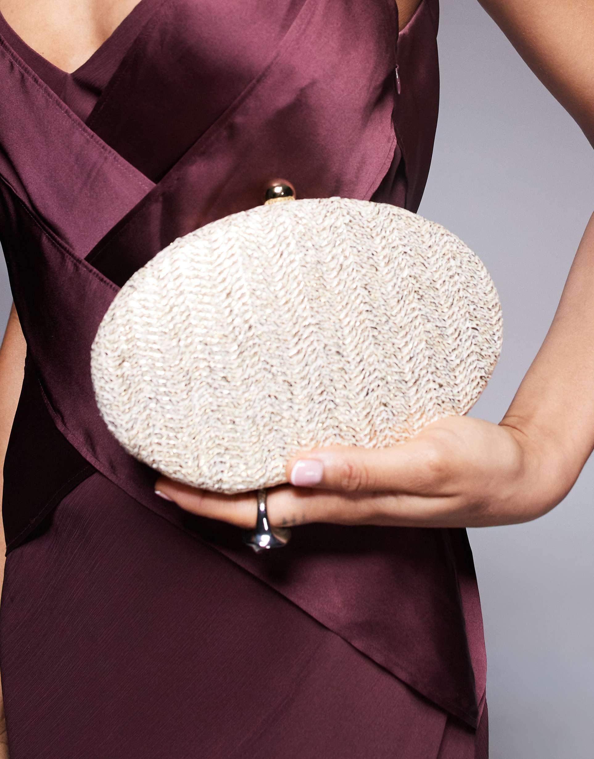 true decadence round structured woven clutch bag in gold metallic