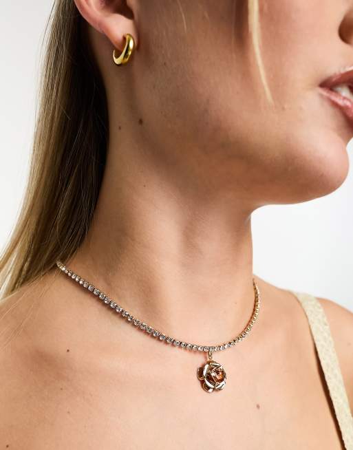 True Decadence - Schakelketting met bloemhangertje in goudkleur
