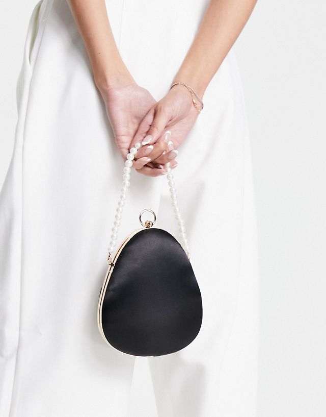 True Decadence structured grab bag in black satin with pearl ring handle