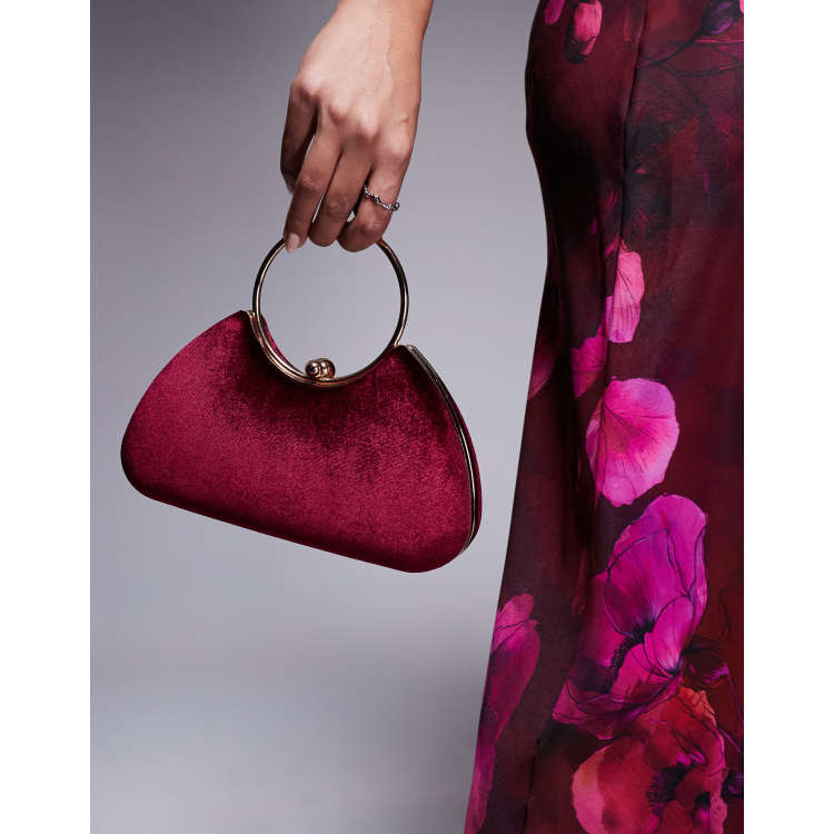 True Decadence velvet clutch bag with detachable crossbody strap in burgundy and gold