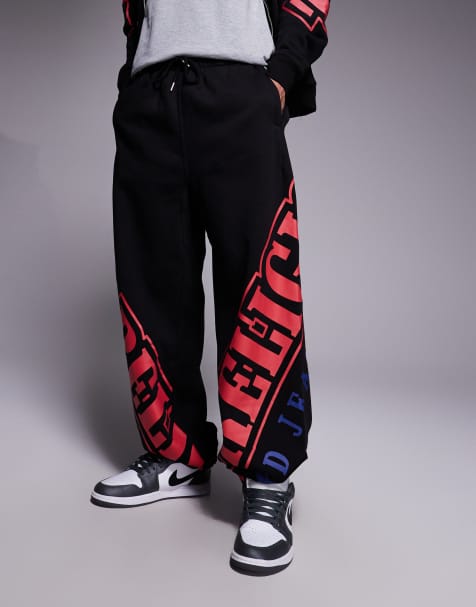 True Religion – Jogginghose in Schwarz mit bogenförmigem Logo und Kordelzug, Kombiteil - view 1