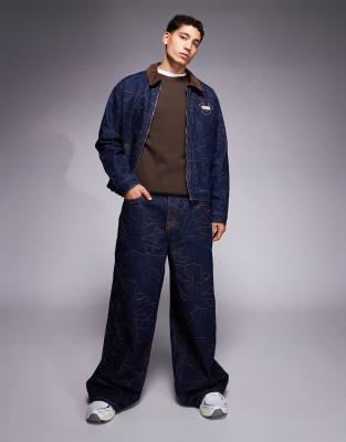 True Religion - Mikey - Jean d'ensemble ultra-baggy avec poches à rabat et broderies - Bleu foncé délavé