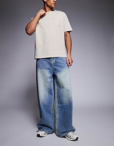 True Religion – Mikey – Superweite Jeans in verwaschenem Blau mit Pattentasche - view 1
