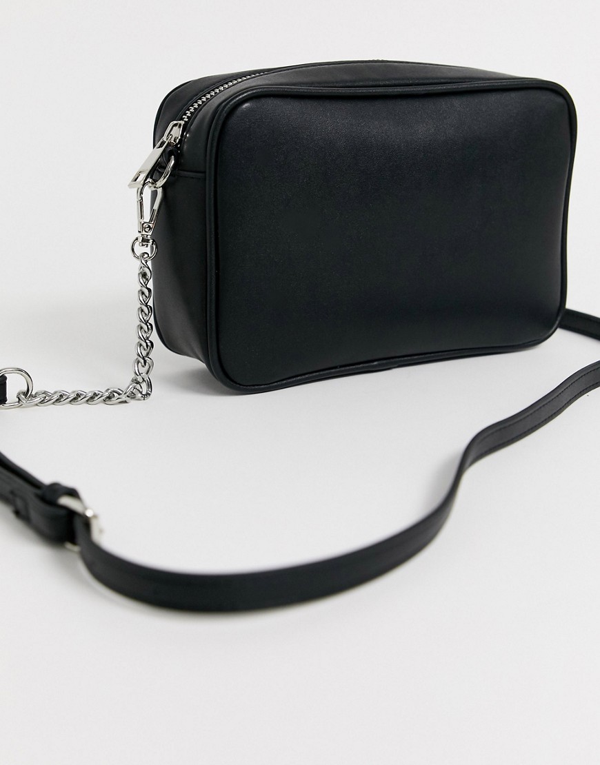 Truffle Collection black cross body bag with tassel