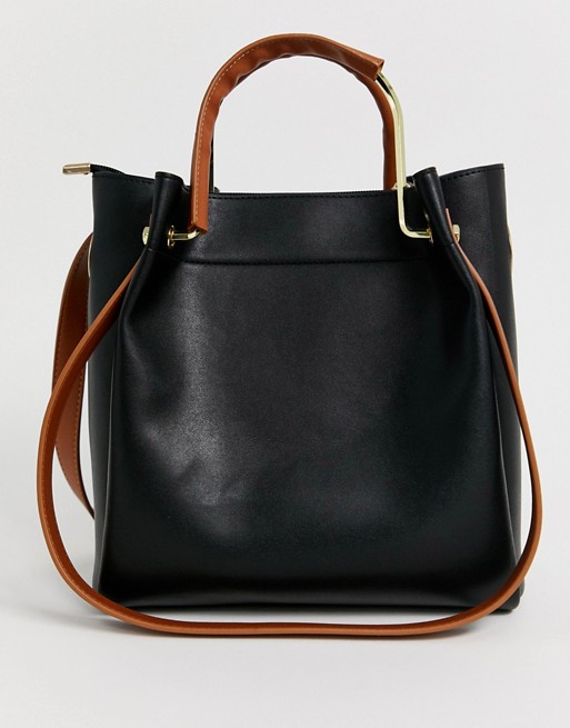 Truffle Collection black tote bag with tan handle and straps