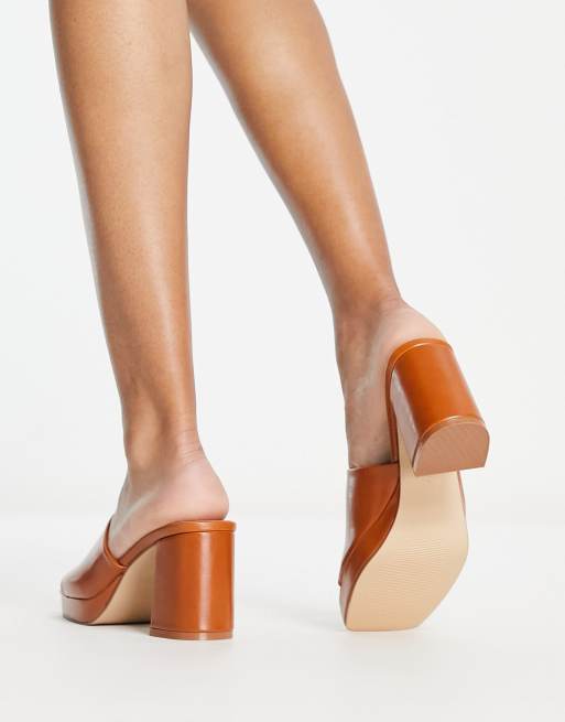 Tan block store heel mules