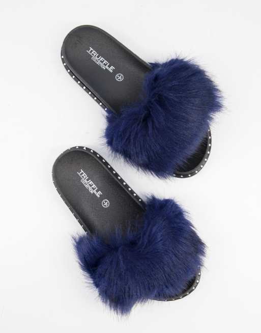 Truffle Collection Chaussons style claquettes avec fausse fourrure Bleu