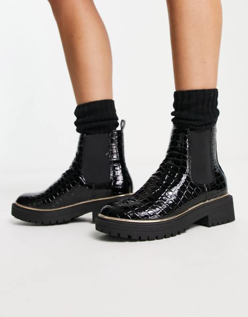 Black boots store with gold trim