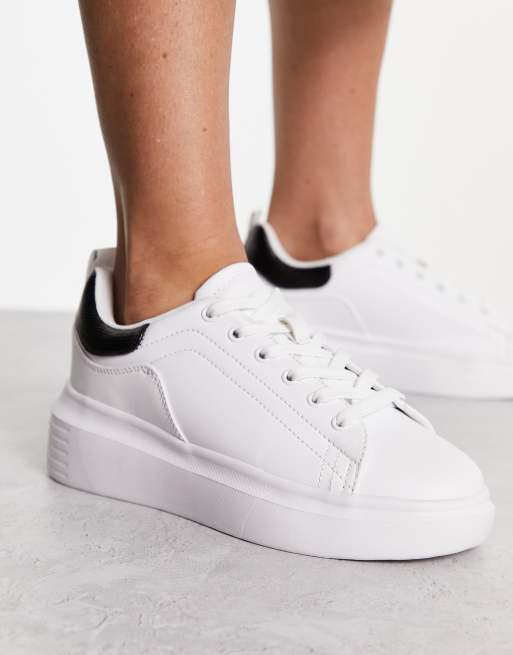 White sneakers with store black back