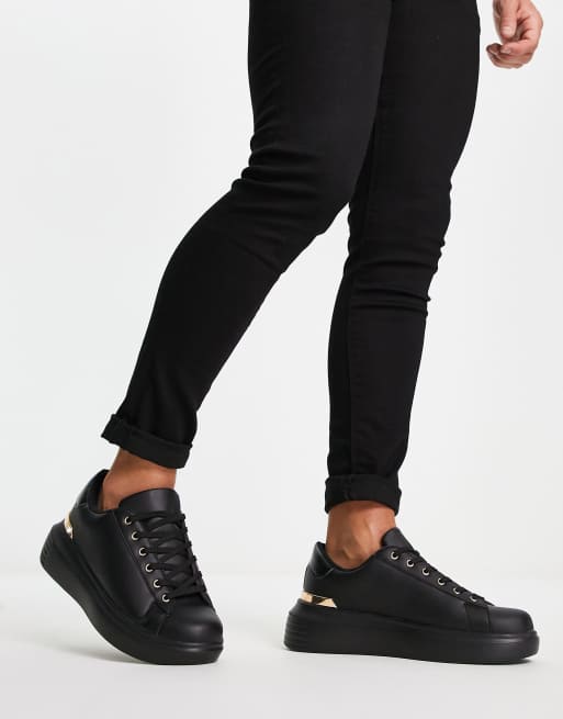 Truffle Collection – Czarne minimalistyczne buty sportowe na grubej podeszwie z ozdobną wstawką z tyłu