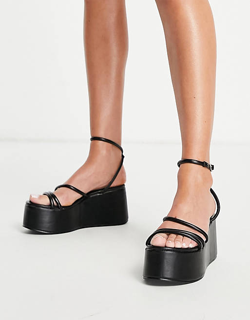 Truffle Collection extreme flatform heeled sandals in black | ASOS
