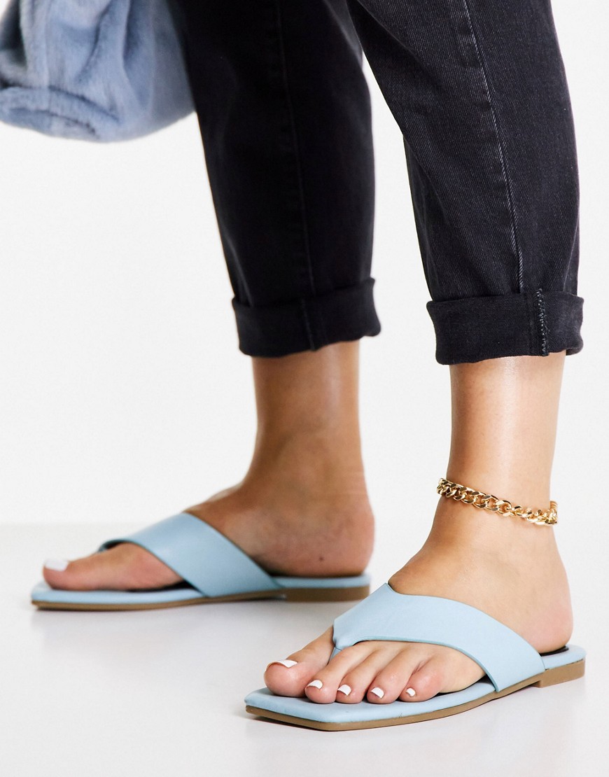 Truffle Collection extreme square toe thong sandals in blue-Blues