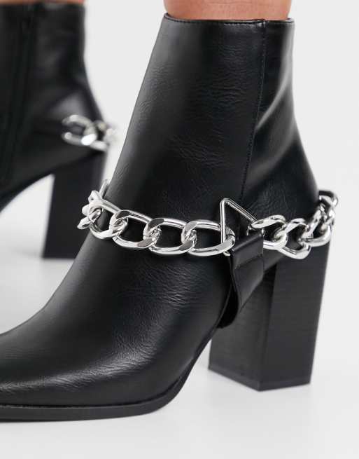 Truffle Collection faux leather square toe heeled boots in black with chain detail