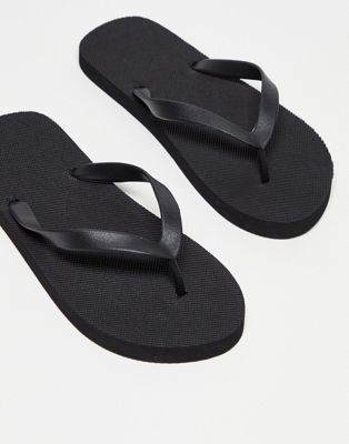 Truffle Collection flip flops in black