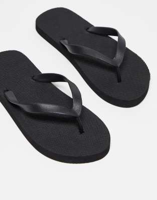 Truffle Collection flip flops in black | ASOS