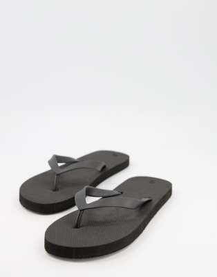 Truffle Collection flip flops in black | ASOS