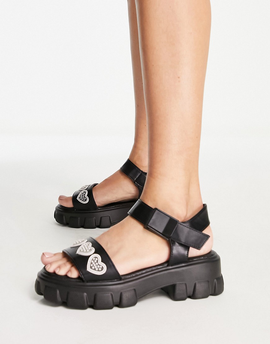 Truffle Collection heart trim chunky sandals in black