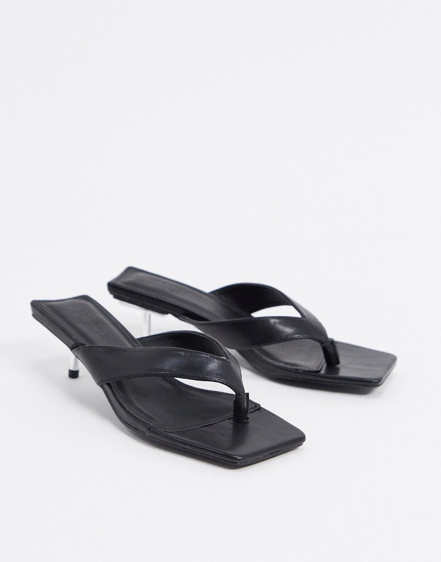 Truffle Collection heel detail flip flop mules in black