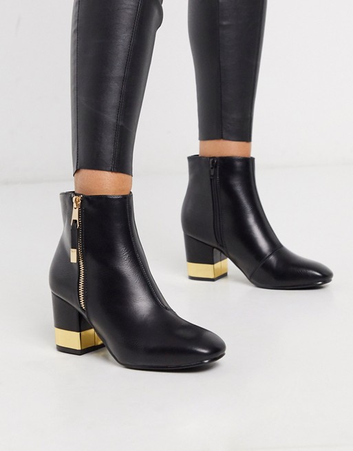 Truffle Collection heeled buckle boots in black