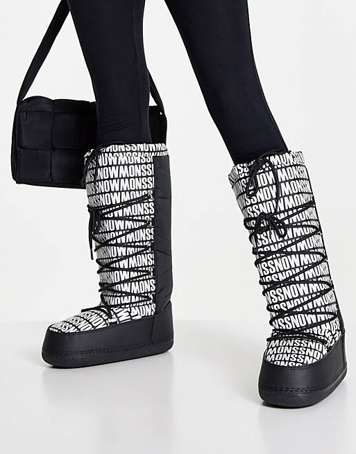 Truffle Collection high leg snow boots in black mono print