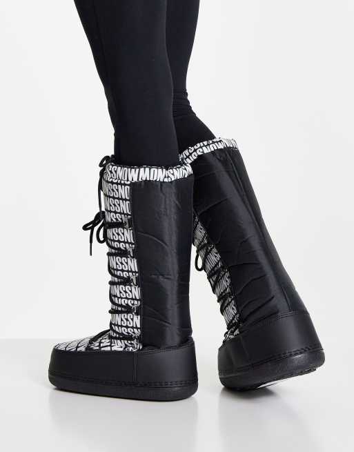 Truffle Collection high leg snow boots in black mono print