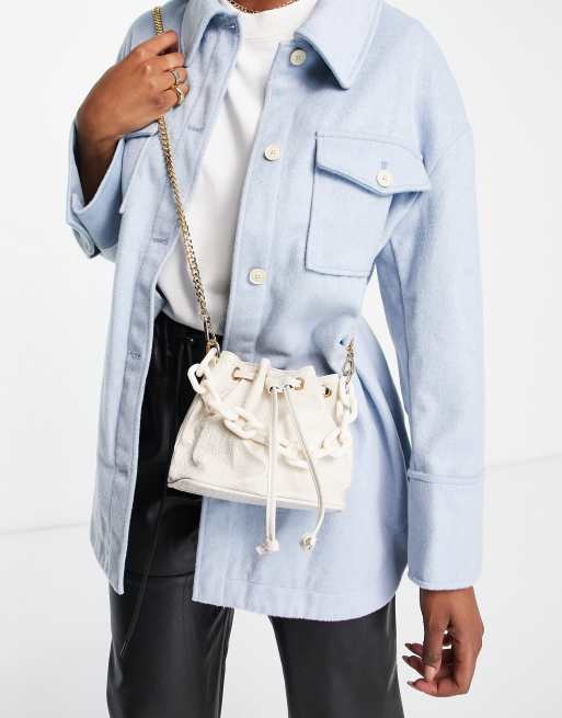 Truffle Collection large link bucket bag in cream