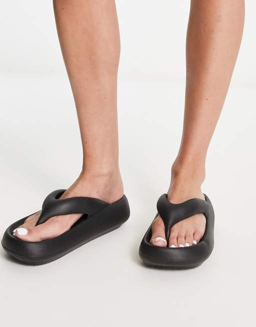 Truffle Collection moulded flip flops in black ASOS