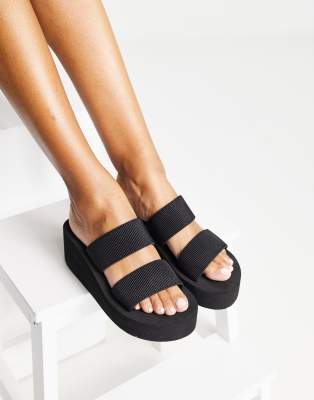 Truffle Collection - Mule-Sandalen in Schwarz mit flacher Plateausohle