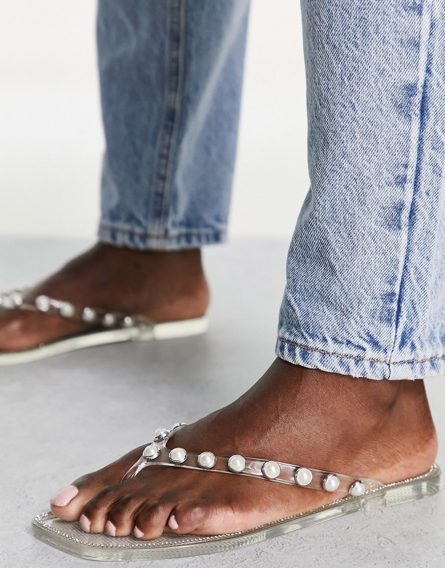 Truffle Collection pearl embellished jelly flip flops in clear