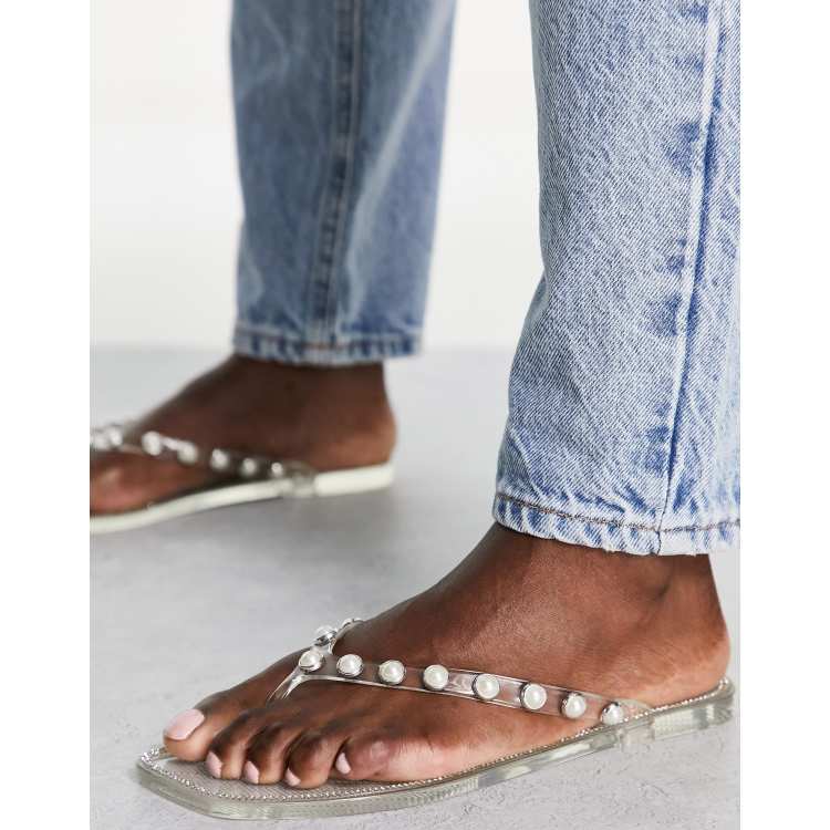 Truffle Collection pearl embellished jelly flip flops in clear