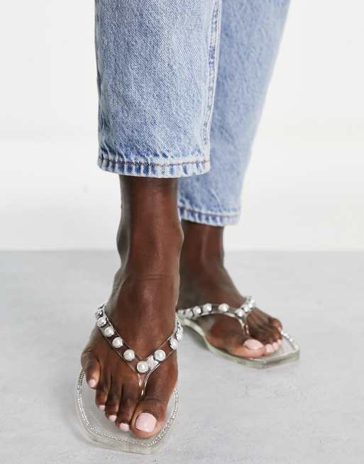 Truffle Collection pearl embellished jelly flip flops in clear