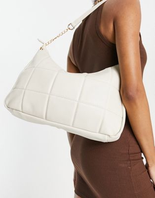 Truffle Collection quilted shoulder bag in beige