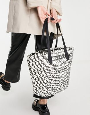 Truffle Collection straw tote bag in black and cream with black handle