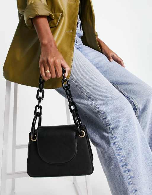 CHARLES & KEITH - Featuring a chunky chain link strap