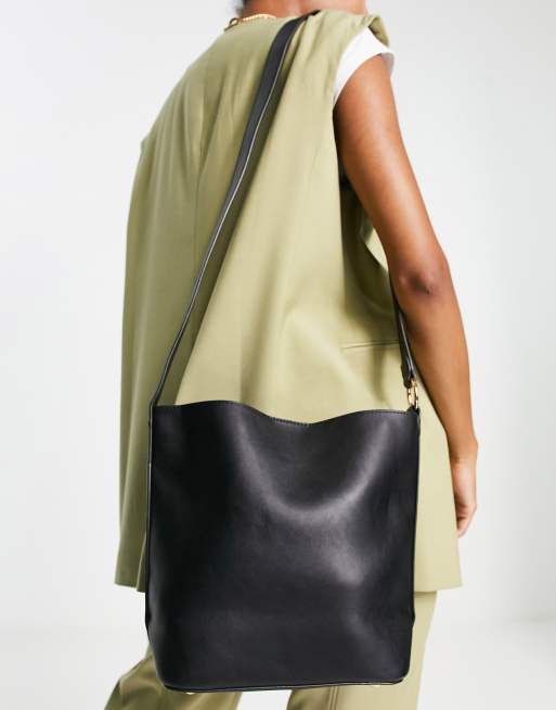 Truffle Collection structured bucket bag with cross body strap in mid tan