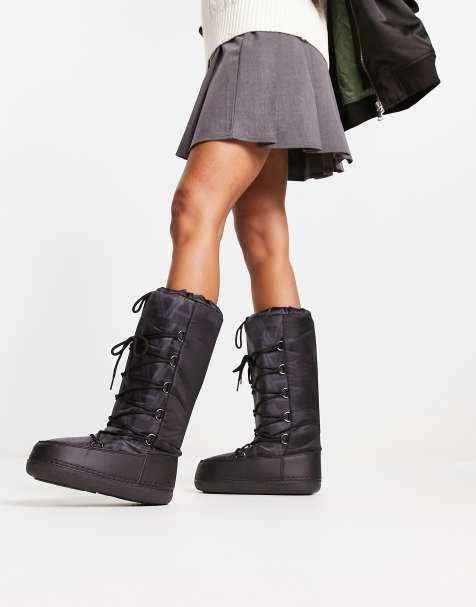 Truffle Collection – Svart- och vitmönstrade snöboots med höga skaft - view 1
