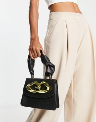 Truffle Collection top handle link detail grab bag in black