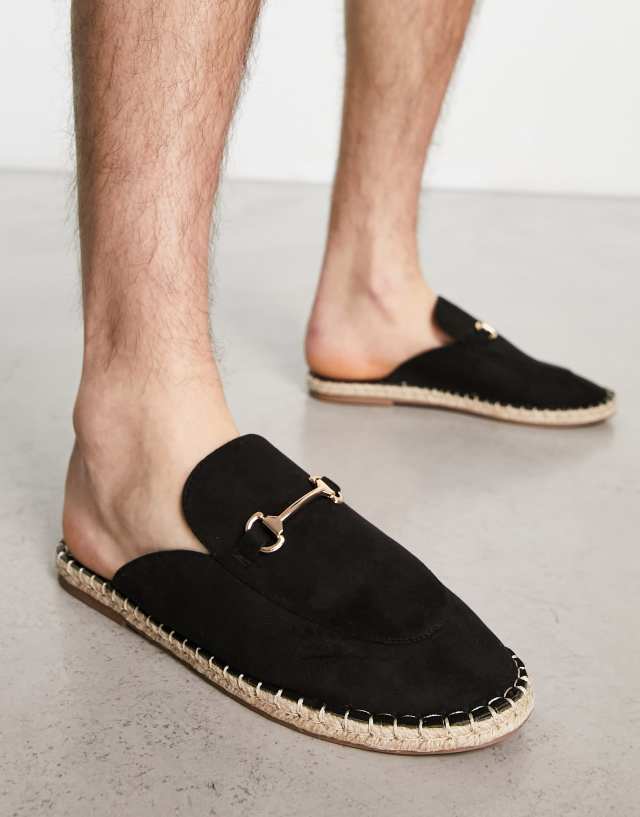 Truffle Collection trim espadrille mules in black faux suede