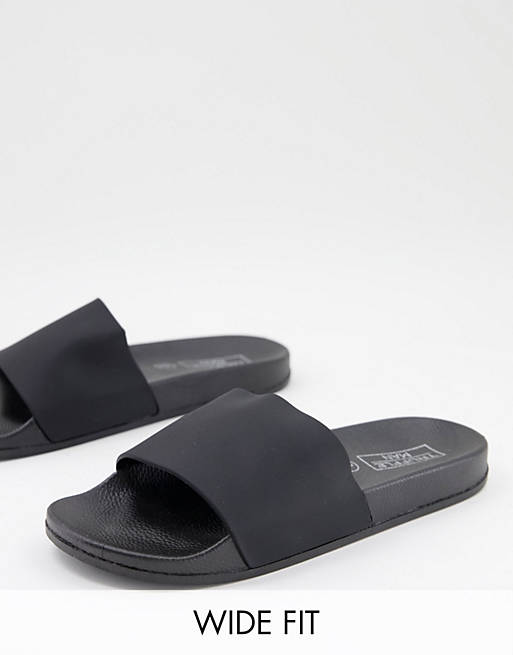 Truffle Collection wide fit faux leather sliders in black | ASOS