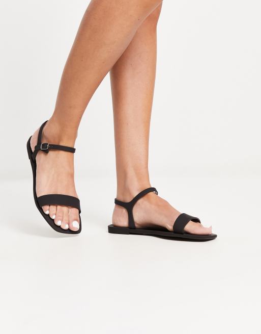 Truffle Collection Wide Fit jelly sandals in black ASOS