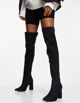 tight fitting thigh high boots